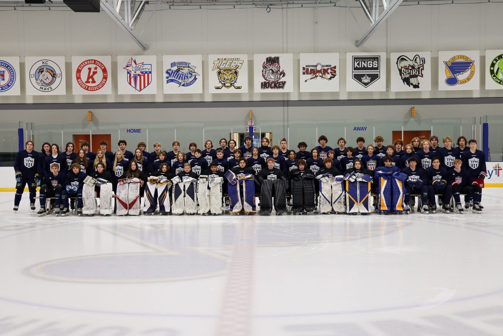 Full academy class photo on the ice at Centene