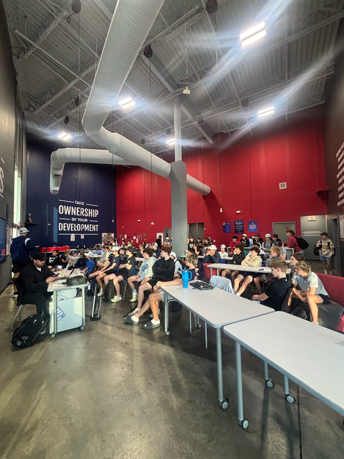 Students in the red collaboration room