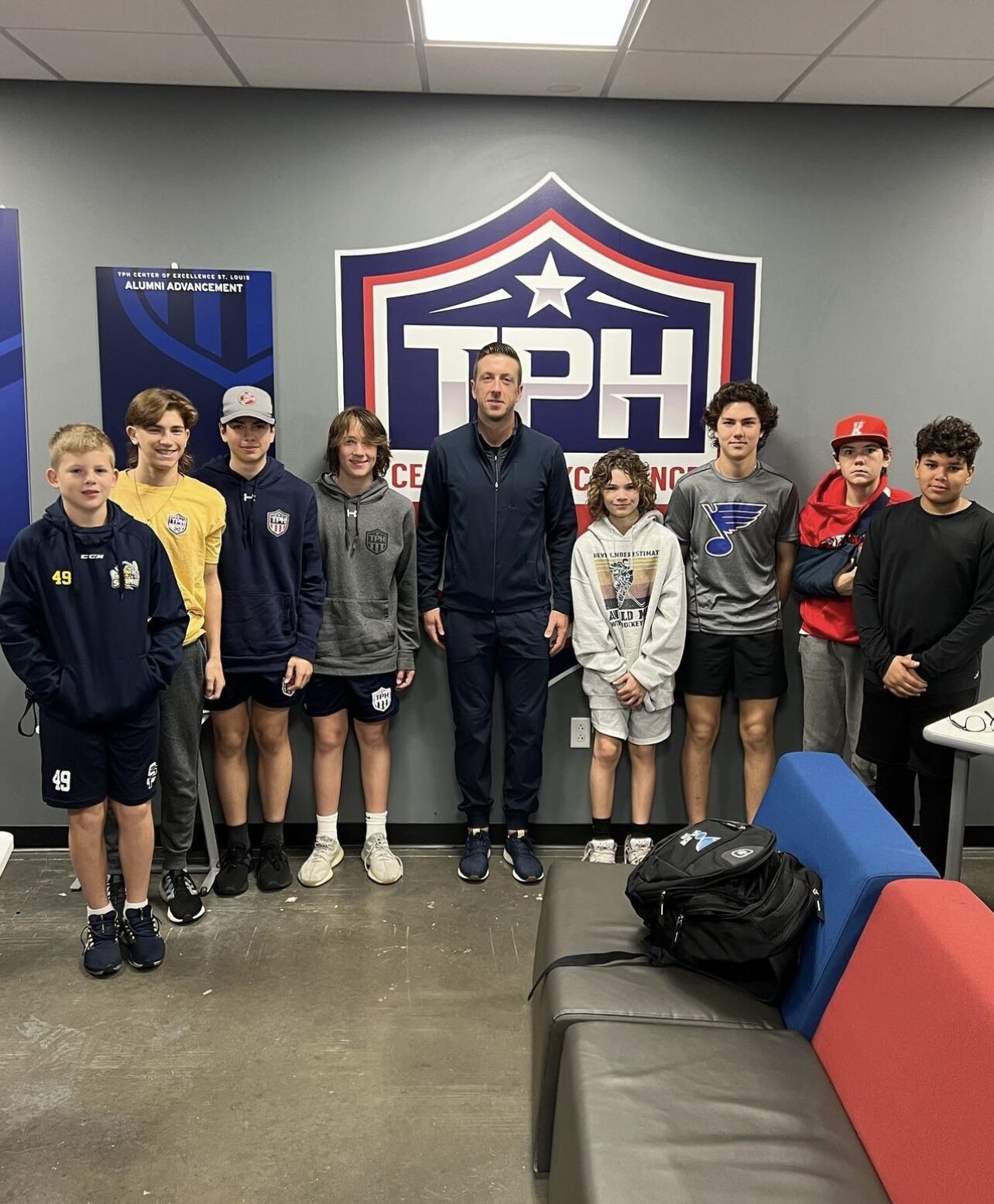 Student-athletes with a guest speaker at the academy