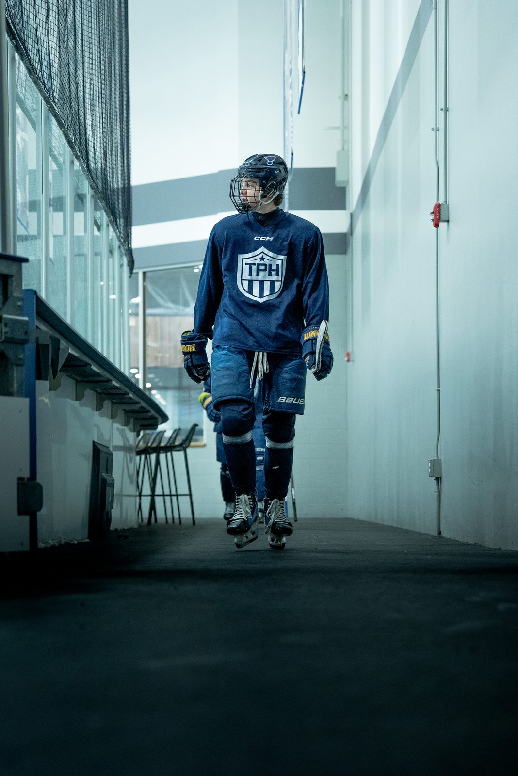 Player walking the tunnel to the ice