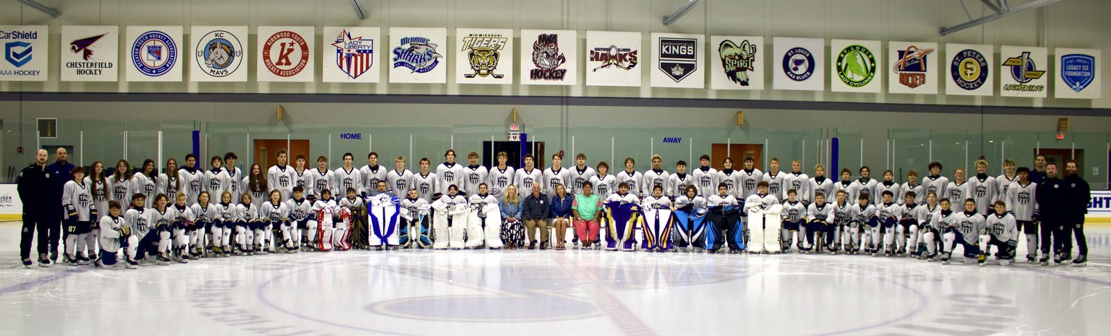 A full academy class gathered on the ice at Centene Community Ice Center