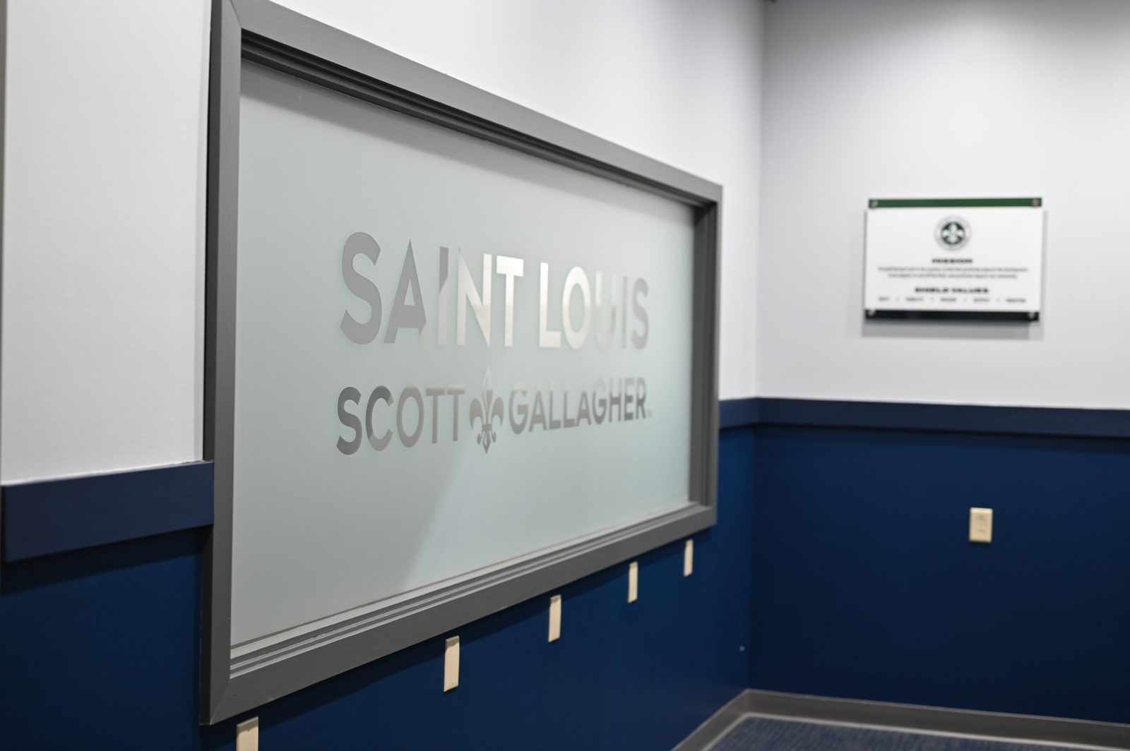 Saint Louis Scott Gallagher wall with the TPH Academy plaque